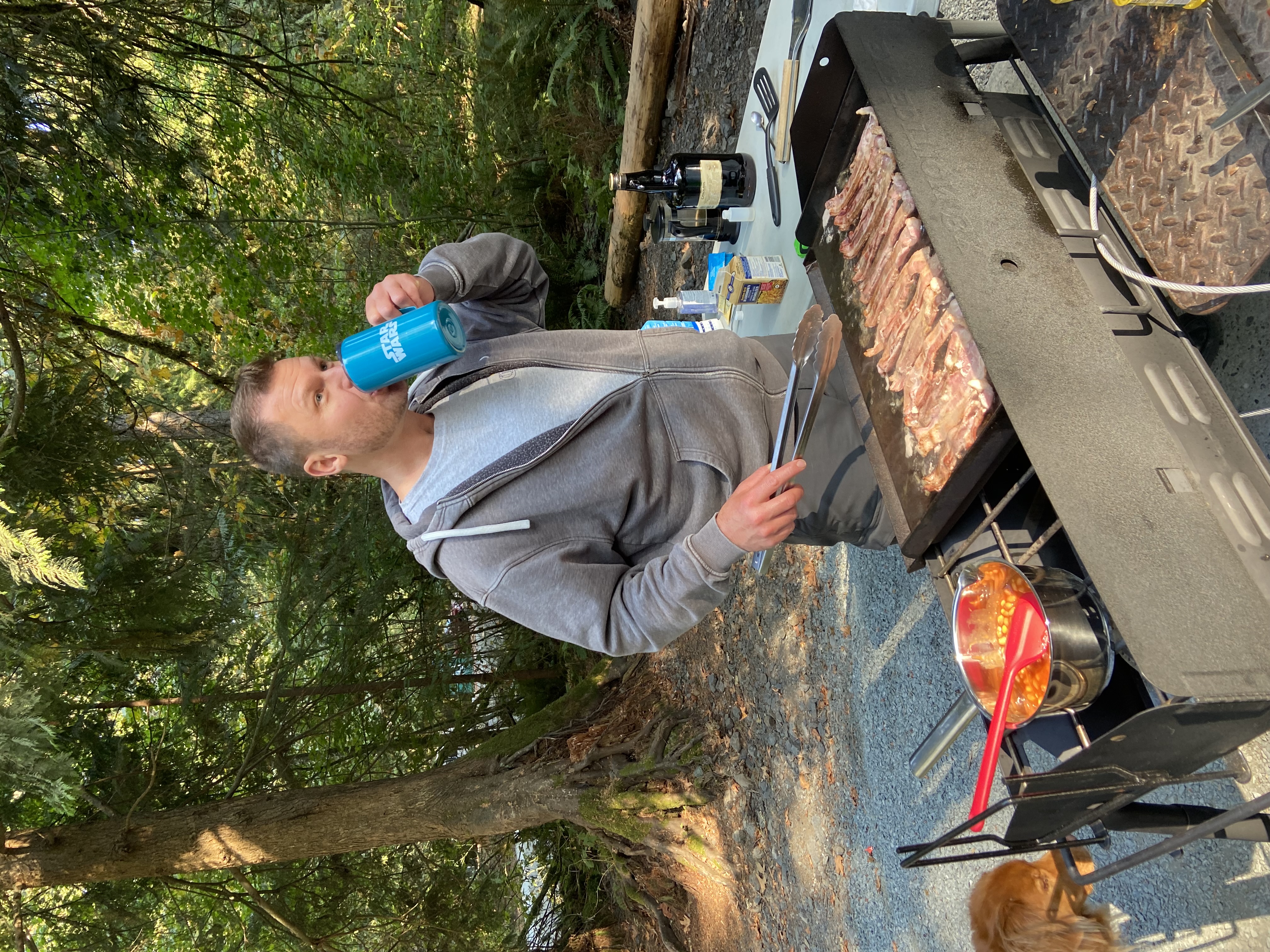 Christian preparing food outdoors while camping.