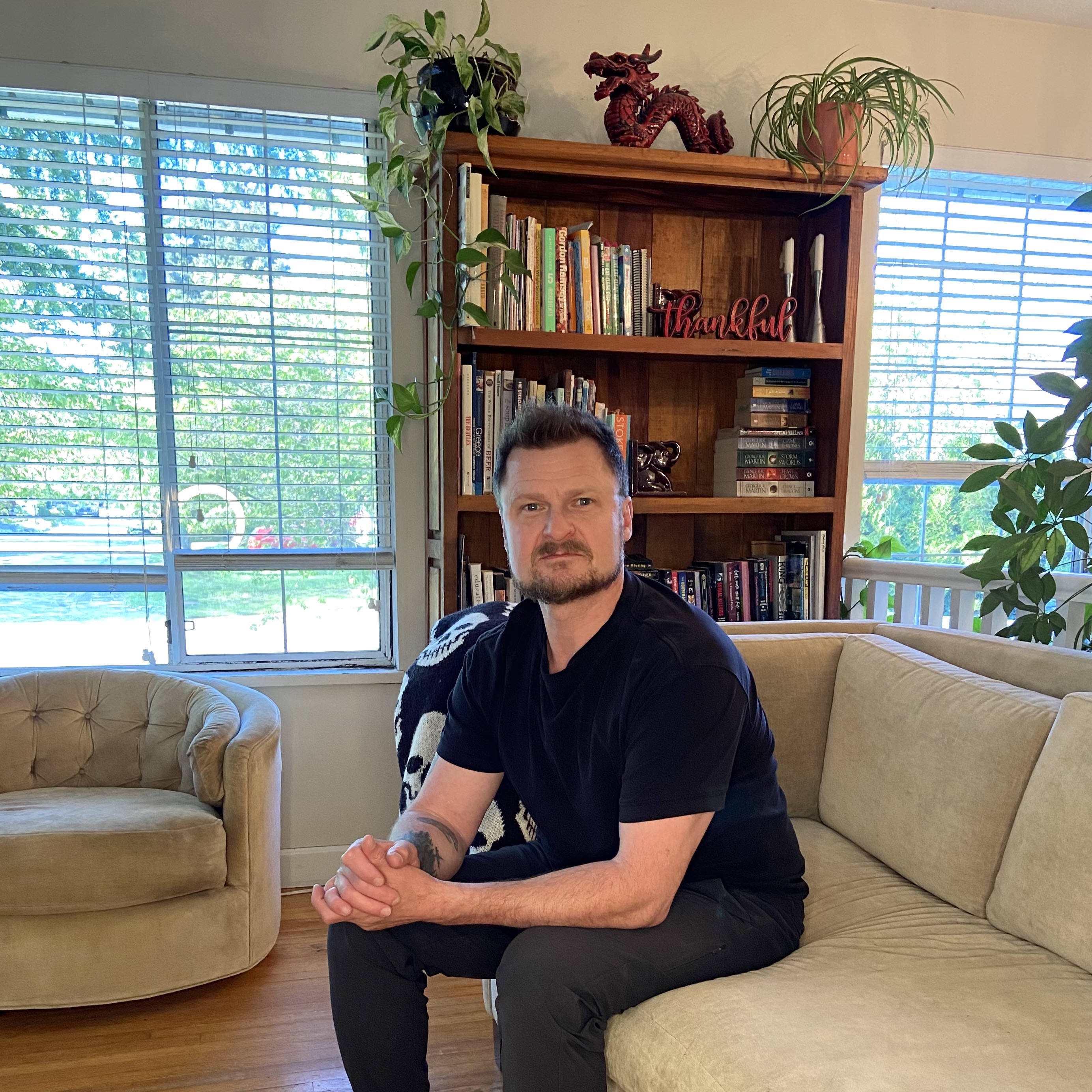 Christian Whalvin seated in a private lounge space.